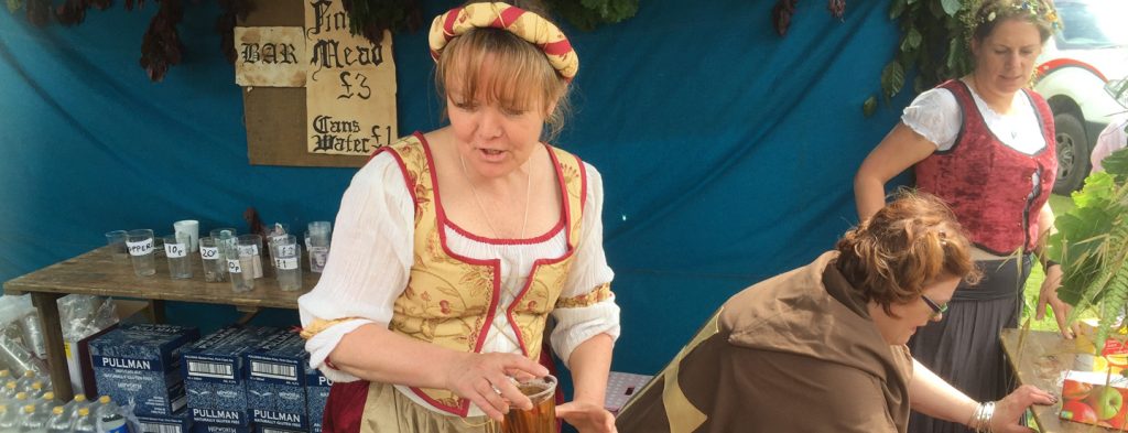 Ladies serving drinks: Grab a drink at the bar where locals will serve wearing mediaeval costumes. All proceeds go to support local charities and amenities