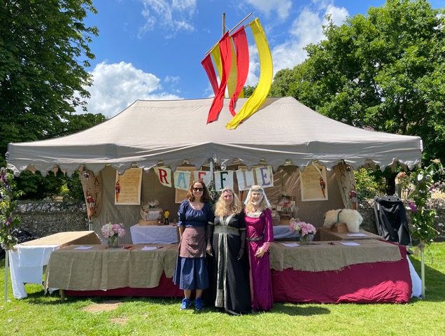 Raffle tent with stall helpers in costume